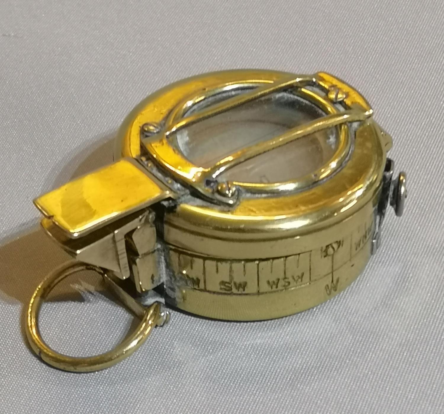 A WWI BRASS ARMY FIELD COMPASS Protective hinged cover, marked ODD No AA745, 1918 MK3A1. (approx