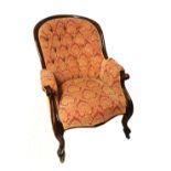 A VICTORIAN MAHOGANY ARMCHAIR In button back floral upholstery on a pink ground, scroll arms and