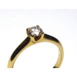 AN 18CT GOLD AND ROUND BRILLIANT CUT DIAMOND SOLITAIRE RING Complete with Anchor Cert Independent