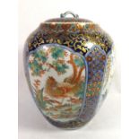 A JAPANESE VASE AND COVER With all over fine hand painted decoration and four panels decorated