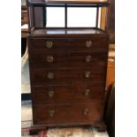 IN THE MANNER OF GILLOW, A MAHOGANY SECRETAIRE CABINET With shelved top above fall front fitted