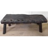 A 17TH/18TH CENTURY SOLID OAK PIG BENCH The 3" top with iron clamp and four square holed sections,