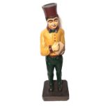 AN EARLY 20TH CENTURY AMERICAN CARVED AND PAINTED WOODEN FIGURE OF A WAITER/BELL BOY. (h 96cm)