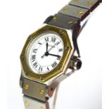 CARTIER, SANTOS, A LADIES' TWO TONE BRACELET WATCH With hexagonal case, boxed.