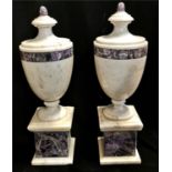 A PAIR OF ITALIAN MARBLE URNS Classical form with amethyst marble banding.