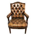 A 19TH CENTURY MAHOGANY OPEN ARMCHAIR Upholstered in a green button back leather, with acanthus