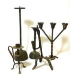 A 17TH/18TH CENTURY IRON RUSH LIGHT Along with four candle stands. (largest 38cm)