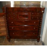 A VICTORIAN MAHOGANY SCOTCH CHEST OF DRAWERS With an arrangement of short and long drawers flanked