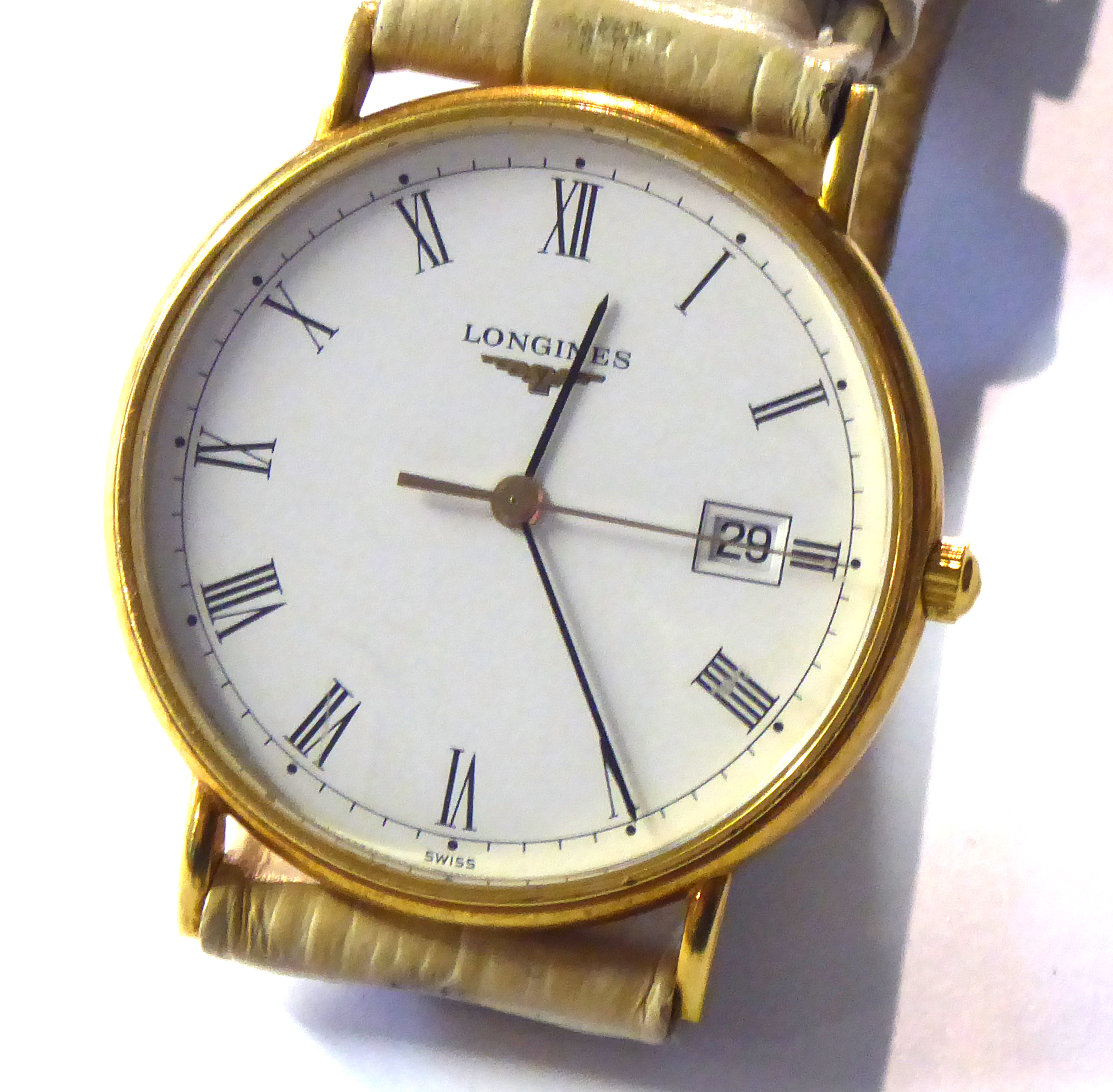 LONGINES. AN 18CT GOLD CASED WATCH. Having white dial, roman numerals.