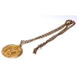 A VINTAGE 9CT GOLD ST. CHRISTOPHER PENDANT MEDALLION AND NECKLACE. Circular form with embossed