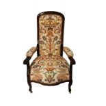 A VICTORIAN MAHOGANY OPEN ARMCHAIR In Colefax and Fowler upholstery, raised on cabriole legs on