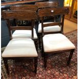 A SET OF FOUR REGENCY PERIOD MAHOGANY DINING CHAIRS With carved bar backs, upholstered seats on