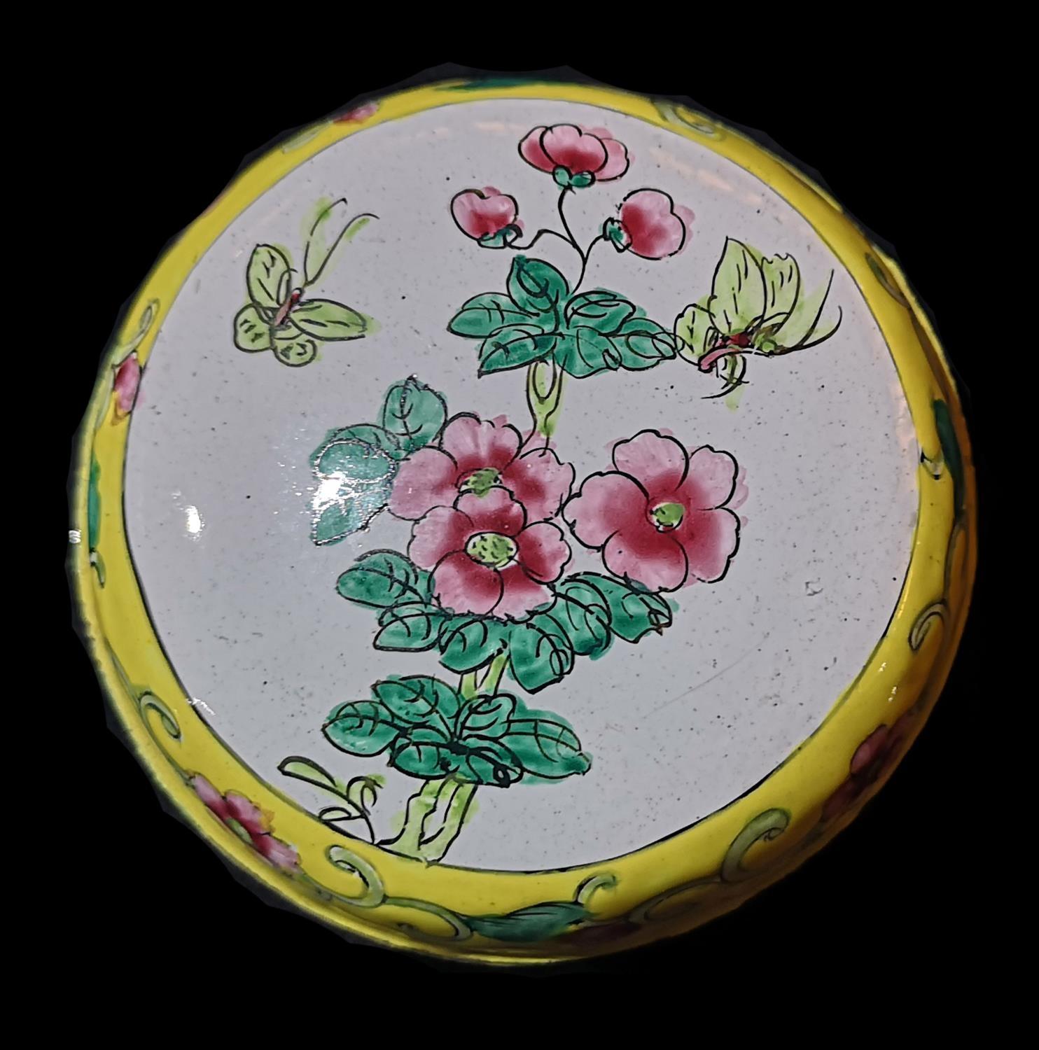 A CANTON ENAMEL ON SPHERICAL COPPER BOX Decorated with flowers and insects in yellow ground. (approx