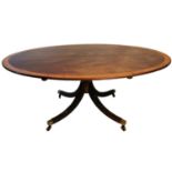 A LARGE REGENCY DESIGN OVAL MAHOGANY AND AMBOYNA BANDED OVAL DINING TABLE Raised on a turned