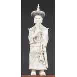 A LATE 19TH/EARLY 20TH CENTURY CHINESE CARVED IVORY EMPEROR. (h 15cm)