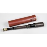 NEGRETTI & ZAMBRA, LONDON, A LATE 19TH CENTURY LEATHER MOUNTED BRASS DRAW TELESCOPE.