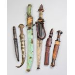 A LATE 19TH/EARLY 20TH CENTURY COLLECTION OF NORTH AFRICAN TRIBAL DAGGERS AND SWORDS.