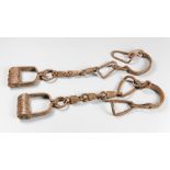 A PAIR OF 19TH CENTURY SLAVE TRADERS LEG IRONS.