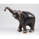 A LATE 19TH/EARLY 20TH CENTURY CARVED EBONISED TEAK ELEPHANT. (h 34cm)
