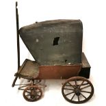 A 19TH CENTURY COVERED WAGON DOG CART With canvas covered top on wooden body with iron suspension