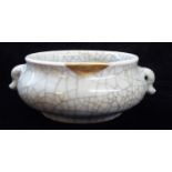 A LATE 18TH/EARLY 19TH CENTURY CHINESE CELADON CRACKLE GLAZE CENSER Having twin handles and gilt