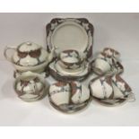CROWN DUCAL, AN ART DECO POTTERY TEA SERVICE Comprising a teapot stand, six cups and saucers,