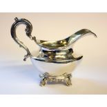 A WILLIAM IV SILVER CREAM JUG Having a scrolled handle and gilt interior, hallmarked Hoseph and