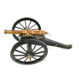 A LATE 19TH/EARLY 20TH CENTURY BRONZE CANNON WITH FIELD CARRIAGE. (98cm x 57cm x 41cm)