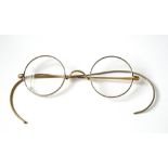 A PAIR OF LATE 19TH/EARLY 20TH CENTURY ROLLED GOLD READING SPECTACLES Circular lenses with white