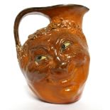 MARTIN BROTHERS, BRITISH, ESTABLISHED 1873, A LARGE GLAZED STONEWARE DOUBLE FACE JUG Signed with