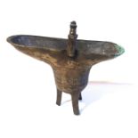 A CHINESE ARCHAIC FORM BRONZE OVAL EWER With geometric decoration and tripod legs, bearing a ?