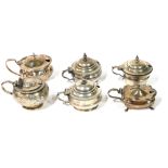 A COLLECTION OF SIX GEORGIAN SILVER MUSTARD POTS