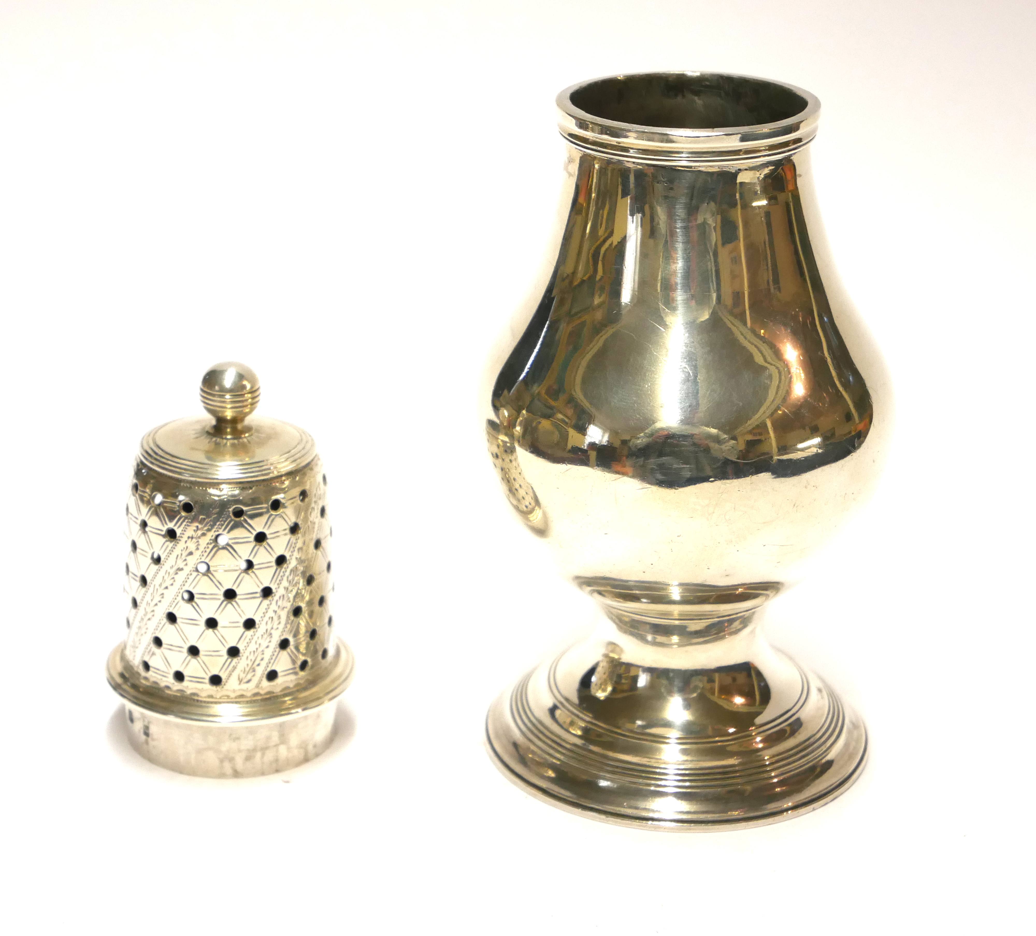 A GEORGIAN SILVER BALUSTER CASTER Having a pierced dome lid, hallmarked Thomas Meriton, London,