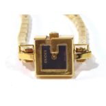 GUCCI, A VINTAGE GOLD PLATED LADIES' WRISTWATCH Having a ?G? form dial, monogrammed to bracelet. (