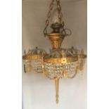 A 19TH CENTURY HEAVY GILT BRONZE FOUR BRANCH CHANDELIER The central tapering and fluted torch