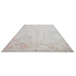 AN INDIAN AGRA RUG OF CARPET PROPORTIONS Traditional mogul design, with central floral field