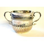 A WILLIAM III SILVER PORRINGER Twin handles and half flute decoration, hallmarked William Andrews,