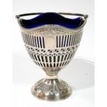 A GEORGIAN SILVER AND BLUE GLASS SWEETMEAT BASKET Classical form with swing handle and pierced