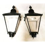 A PAIR OF VICTORIAN STYLE PAINTED COPPER AND STEEL POST LANTERNS With turned finials on caddy tops