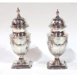 A PAIR OF VICTORIAN SILVER CASTERS Classical form with embossed swags and bows, hallmarked Atkin