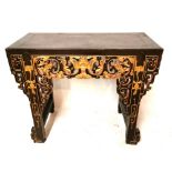 A CHINESE ALTAR TABLE The pierced carved apron with gilded highlights in the form of foliage ,on