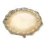 GOLDSMITH AND SILVERSMITHS, A VICTORIAN SILVER SALVER Scrolled shell border and eagle and claw feet,