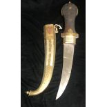 AN EARLY/MID 20TH CENTURY NORTH AFRICAN JAMBIYA DAGGER With brass bound softwood grip , copper brass