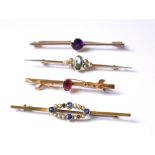 A COLLECTION OF FOUR EARLY 20TH CENTURY 9CT GOLD AND GEM SET BAR BROOCHES To include an oval cut