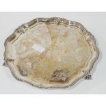 A VICTORIAN ECCLESIASTICAL SILVER SALVER Scrolled form with beaded edge and inscription, dated 1870,