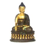 A LATE 19TH/EARLY 20TH CENTURY SINO-TIBETAN GILT BRONZE BUDDHA OF SAKYAMUNI Seated, meditating in