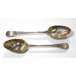 A PAIR OF GEORGIAN NEWCASTLE SILVER BERRY SPOONS Having fine engraved decoration and embossed