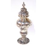 ROBERT TYRILL, A RARE GEORGE III SILVER SUGAR CASTER Having a scrolled and pierced dome lid and