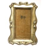 WALKER & HALL, AN EDWARDIAN SILVER EASEL PHOTOGRAPH FRAME Scrolled design hallmarked Sheffield,