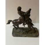 A 19TH CENTURY BRONZE STATUE CENTAUR On green marble base. (37cm x 34cm)